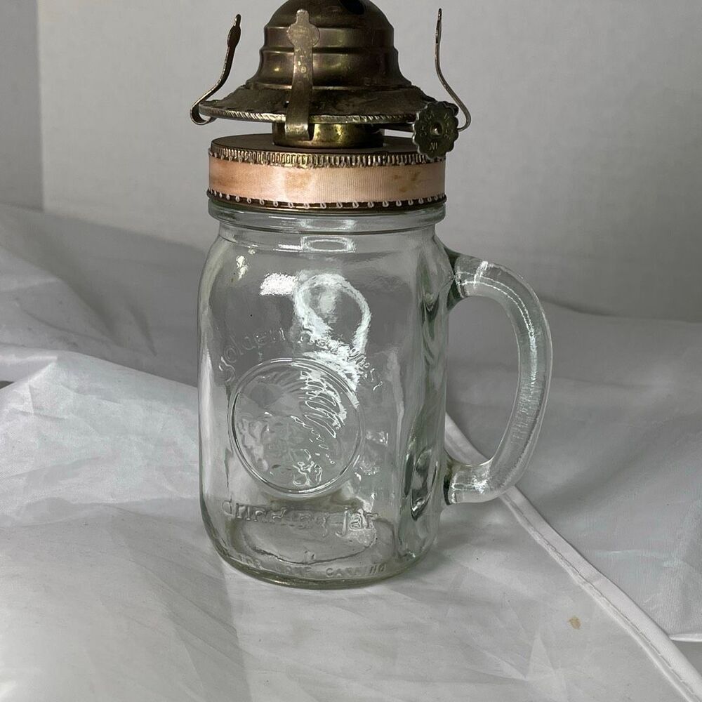 Vintage Golden Harvest drinking jar oil lamp with 2” burner. Pink no wick